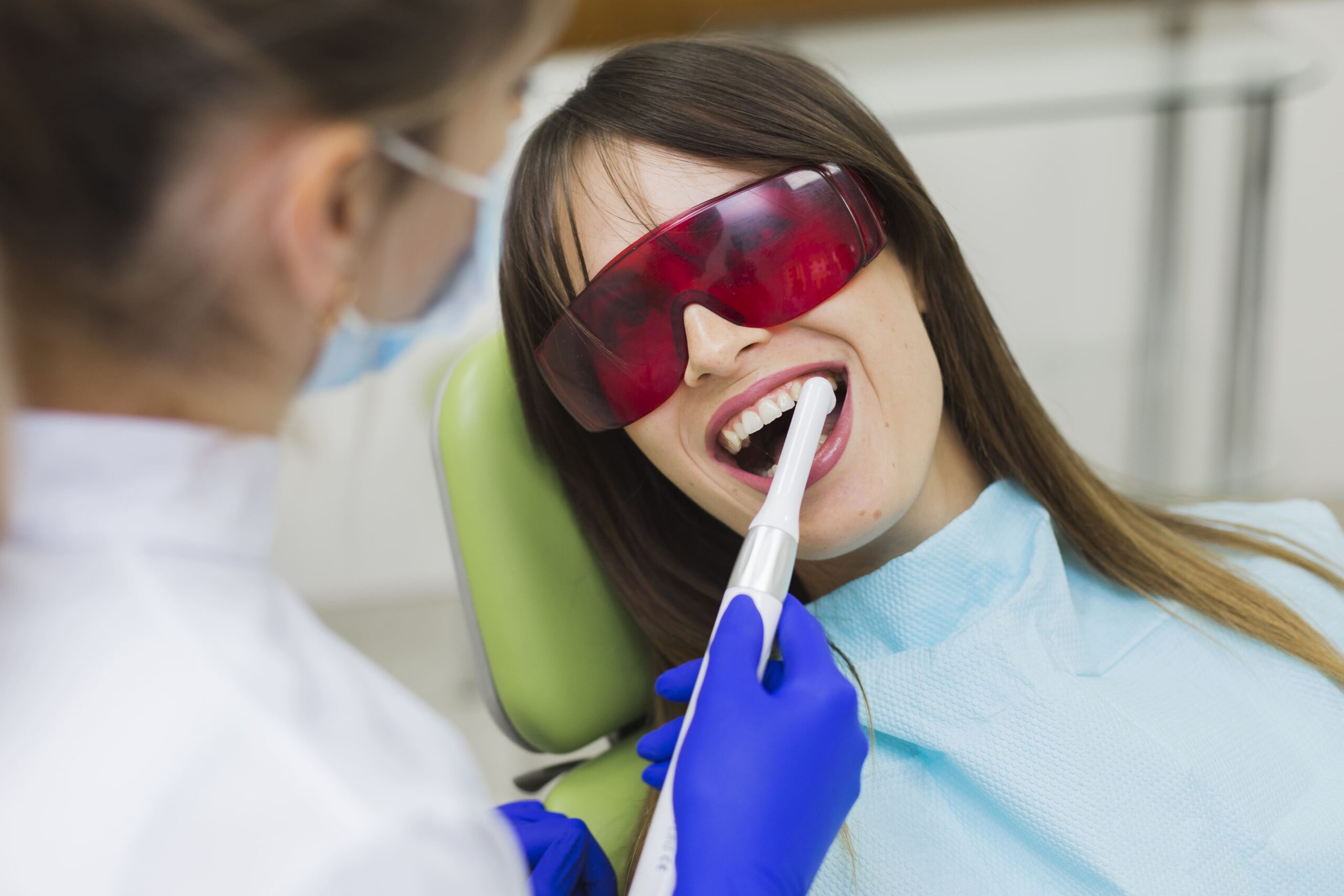 3 Female patient receiving a dental checkup