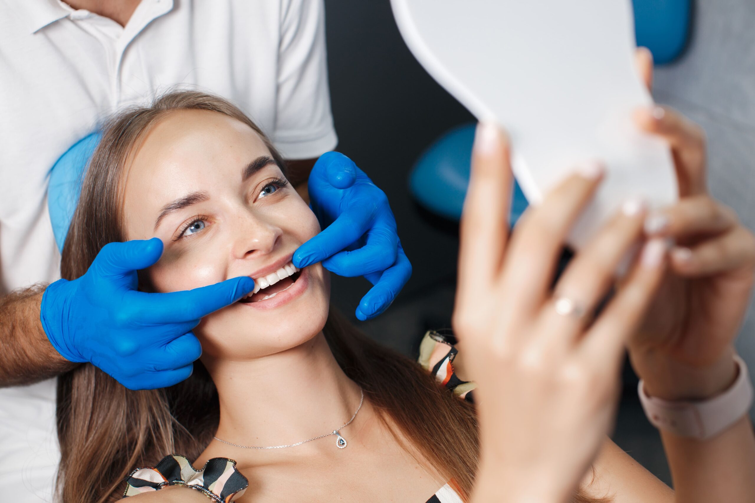 patient-dentist Female patient receiving a dental checkup